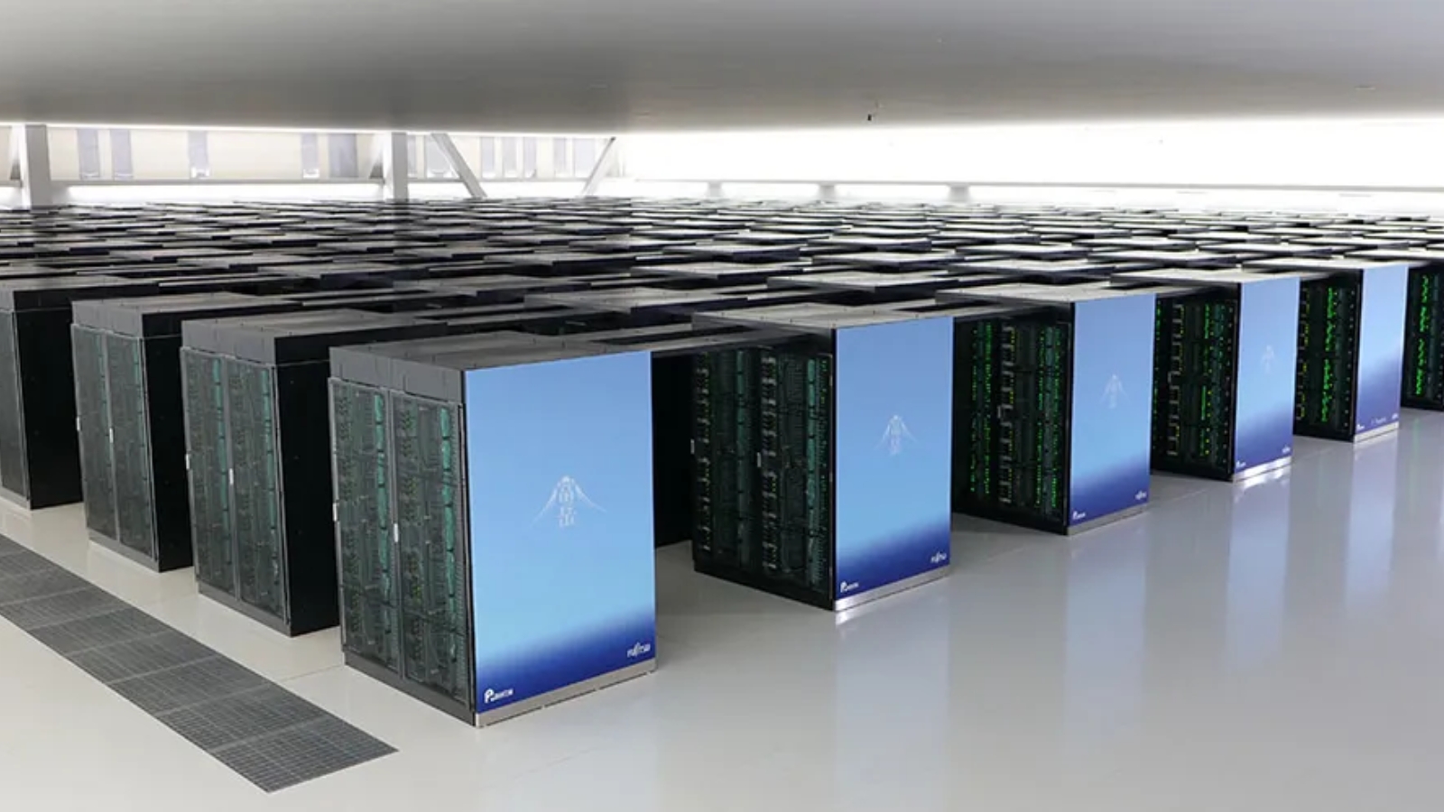 Rows of Fujitsu Fugaku supercomputer racks inside a large high-performance computing data centre.