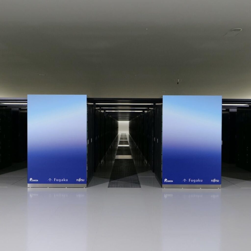 Rows of Fujitsu Fugaku supercomputer racks inside a large high-performance computing data centre.