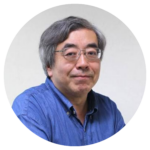 Man with glasses wearing a blue shirt.